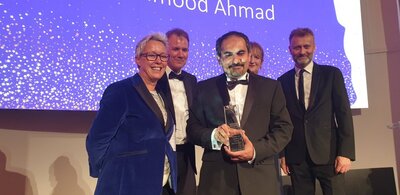 Dr Mahmood Ahmad receiving an award